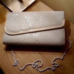 Elegant white metal clutch bag